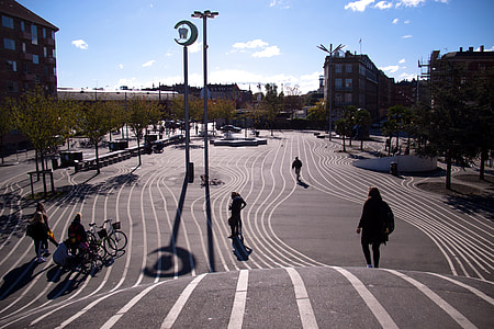 person walking on gray pavement thumbnail