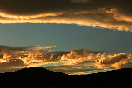 silhouette of mountain during dusk thumbnail