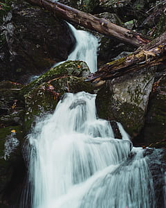 time-lapse photography of waterfalls surrounded of rock formation thumbnail