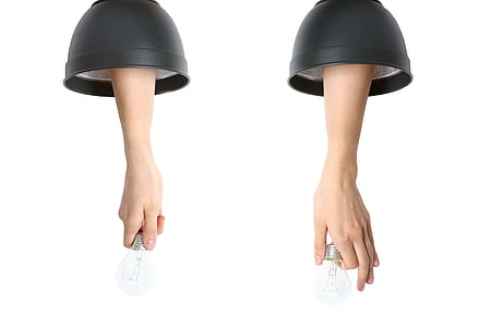 person holding two light bulbs thumbnail