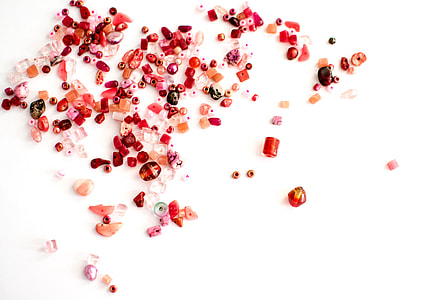 assorted-color beads on white surface thumbnail