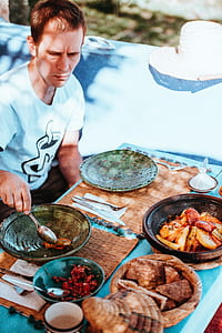 person scooping food on tabletop thumbnail