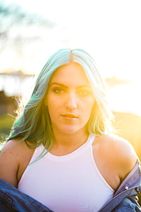 woman wearing white spaghetti strap shirt thumbnail