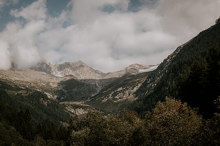aerial view photography of mountains under cloudy sky during daytime thumbnail