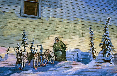 Mural painting of Sled dogs team and their rider on the wall thumbnail