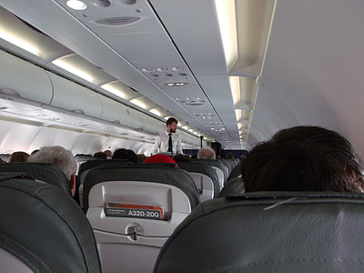 group of people riding in plane thumbnail