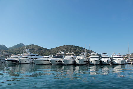 white yacht on body of water thumbnail