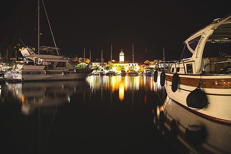 boats near houses during nighttime thumbnail