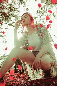 Woman Wearing Gray Cardigan and White Halter Top thumbnail