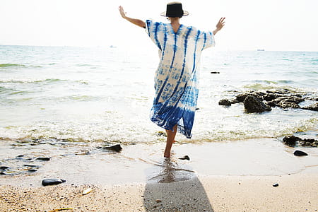 Woman Standing in Front of Body of Water thumbnail