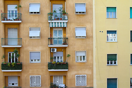 photo of two brown and yellow high rise buildings thumbnail