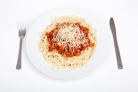 flay lay photography of spaghetti with knife and fork on sides thumbnail