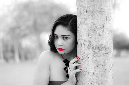 selective color photography of woman in red lipstick and manicure thumbnail