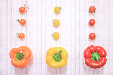 photo of orange, yellow and red bell peppers with cherry tomatoes thumbnail