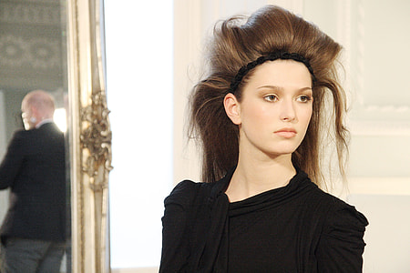 woman wearing black headband and black top thumbnail