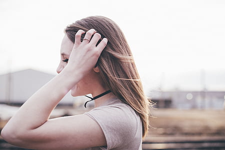 woman holding her hair taken during daytime thumbnail