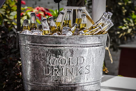 gray stainless steel Cold Drinks embossed bucket filled with Corona Beer bottle lot at daytime thumbnail
