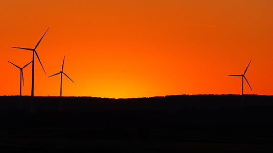 silhouette of windmills during sunset thumbnail