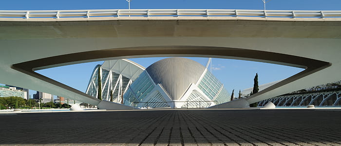 grey and white concrete structure during clear sky thumbnail