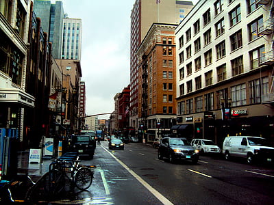 cars passing by on concrete road thumbnail