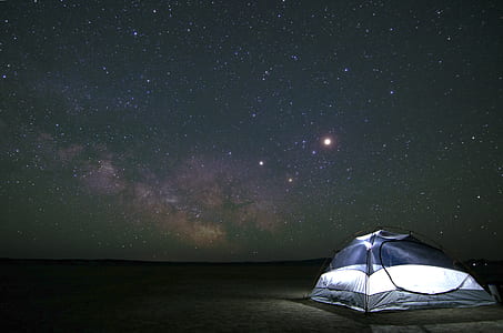 dome gray and white tent on desert during nighttime thumbnail