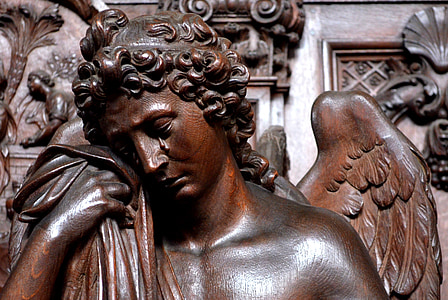 man holding cloth statue thumbnail