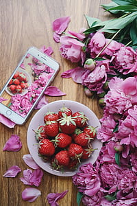 bowl of strawberries beside iPhone with clear case thumbnail