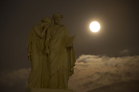 statue of two women during sunset thumbnail