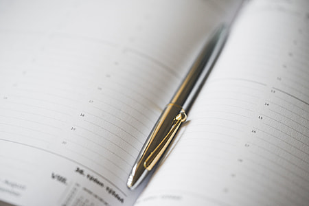 Silver Pen in Open Business Day Planner Diary thumbnail