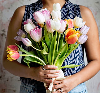 woman holding bouquet of tulips thumbnail