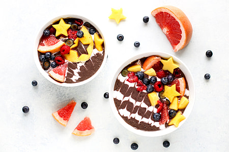 two cake with assorted sliced fruit toppings thumbnail