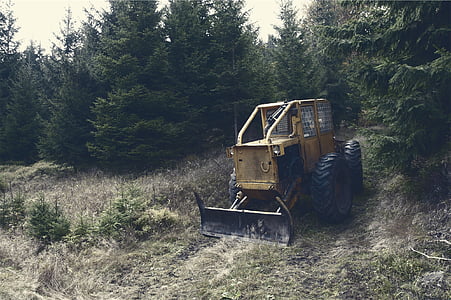 front loader on near the trees thumbnail