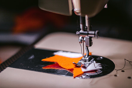 selective focus photography of sewing machine needle thumbnail