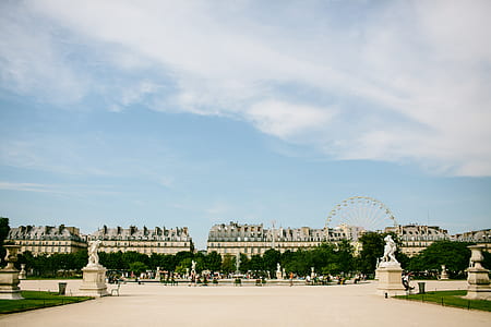 people on park with water fountain during daytime thumbnail