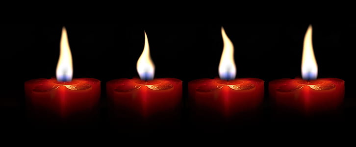 four lighted candles thumbnail