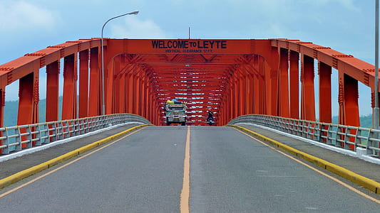 red Leyte bridge under clear blue sky thumbnail