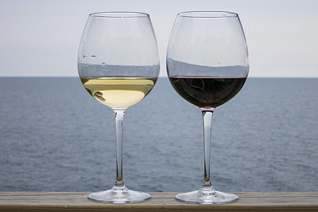 two wine glasses filled with drinks thumbnail