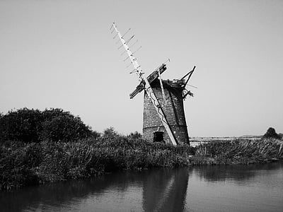 grayscale photography of building near body of water thumbnail