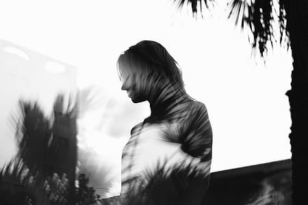 woman near trees during daytime thumbnail