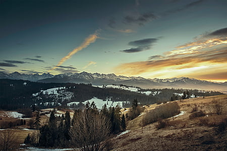 landscape photography of brown and snow mountains thumbnail