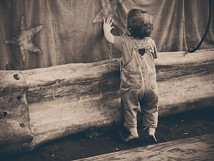 child holding fabric surface