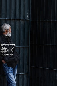man wearing black and white zip-up jacket thumbnail