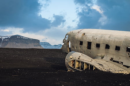 abandoned plane near mountain at daytime thumbnail