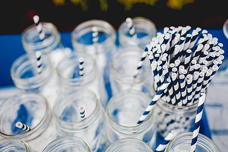 selective focus photography of straws placed on Mason jars thumbnail