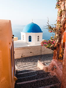 blue and white painted dome building near sea thumbnail