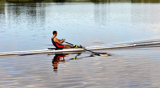 man riding kayak on body of water thumbnail