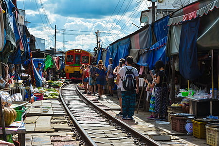 people walking near railway thumbnail
