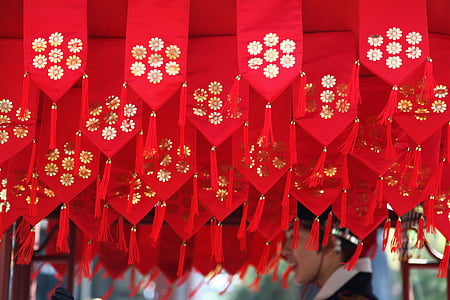 low-angle photography of white-and-red floral textile thumbnail