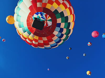 multicolored hot air balloon floating on midair thumbnail