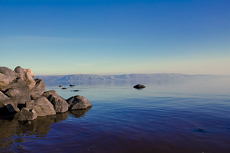 brown stones near body of water thumbnail